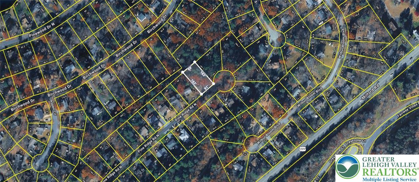 Image 1: An aerial perspective reveals a prime vacant lot a