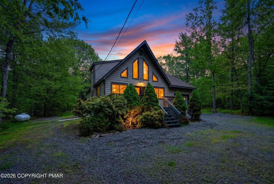 Image 3: Architectural lines meet woodland serenity in this