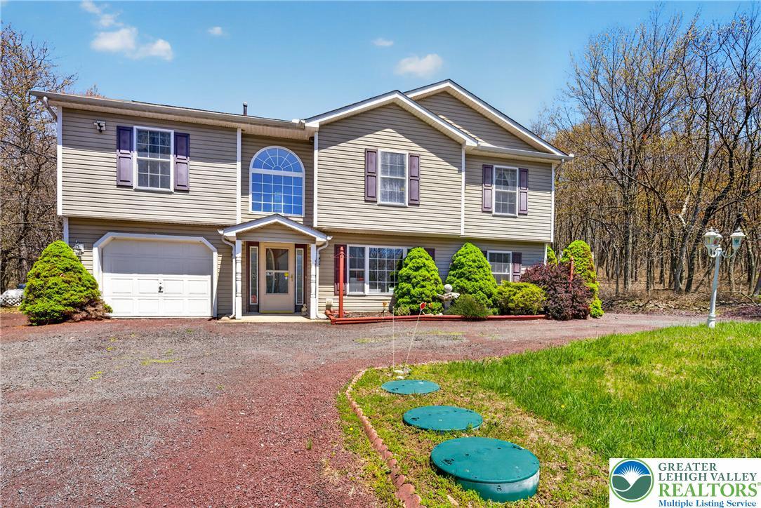 Image 4: This house features a charming exterior with a spa