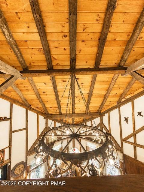 Image 4: This living space features a striking antler-motif