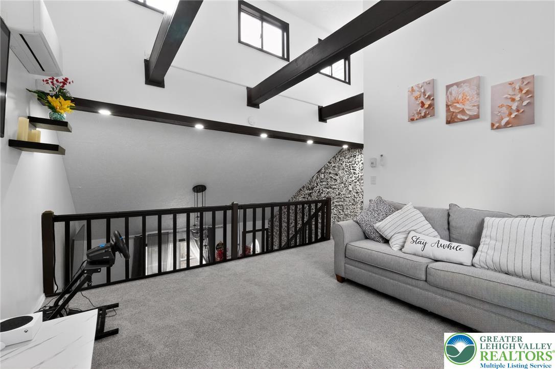 Image 4: This bright and airy space offers comfort with vau