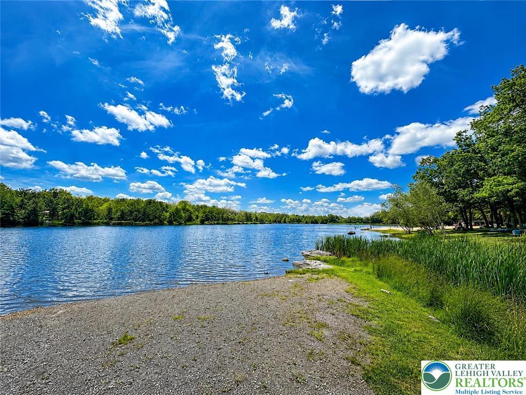 Image 2: A tranquil lakefront setting offers peaceful water