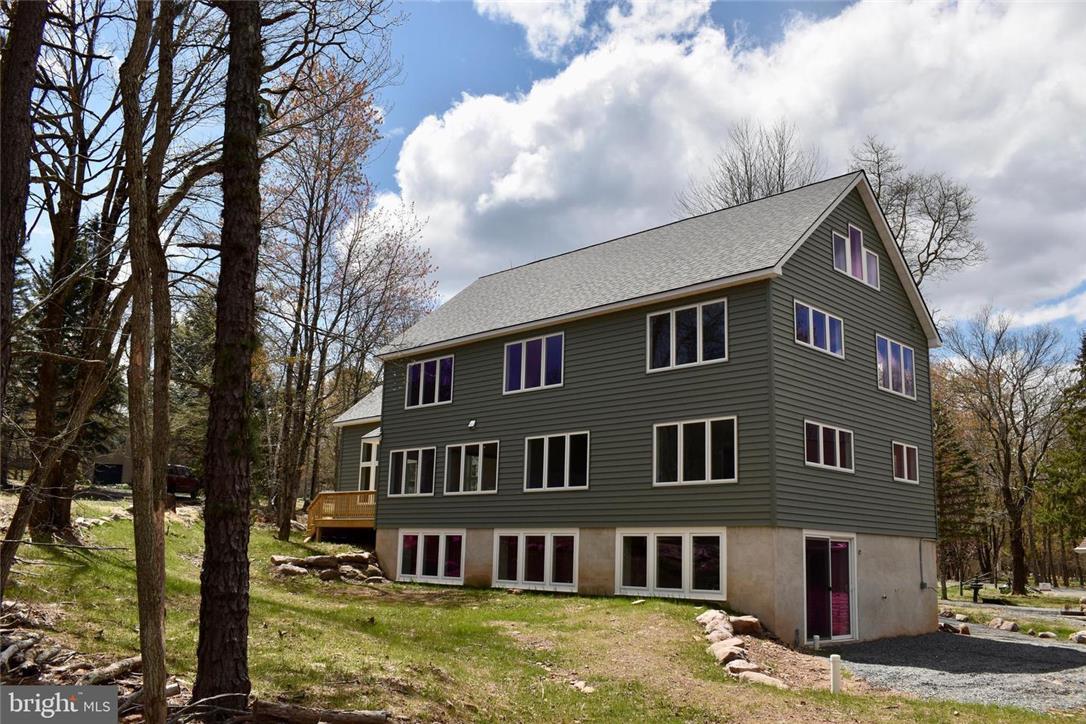 Image 2: A newly constructed residence nestled amidst a woo