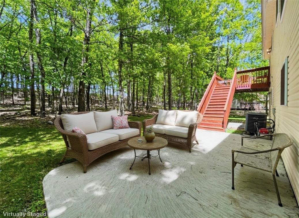 Image 3: A tranquil outdoor living space nestled in a lush,