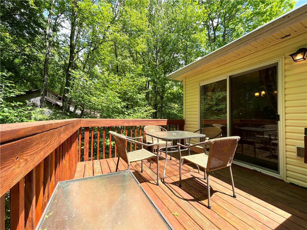 Image 4: A spacious wooden deck provides a private outdoor
