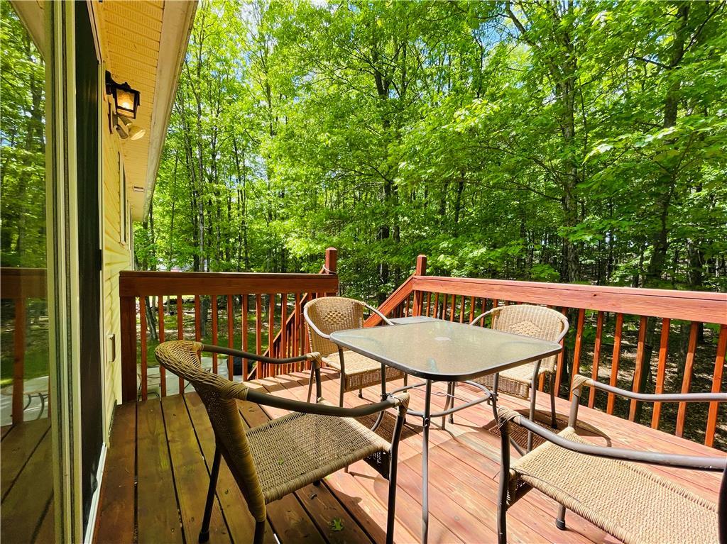 Image 4: A spacious wooden deck provides a tranquil outdoor