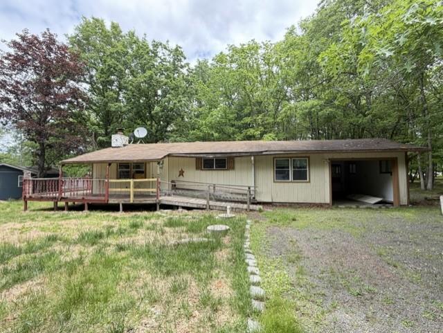 Image 2: A quaint residence featuring a covered deck and in