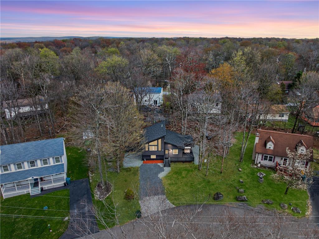 Image 2: An aerial perspective reveals a charming, modern r