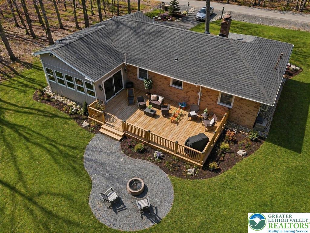 Image 4: This home features an expansive outdoor living are