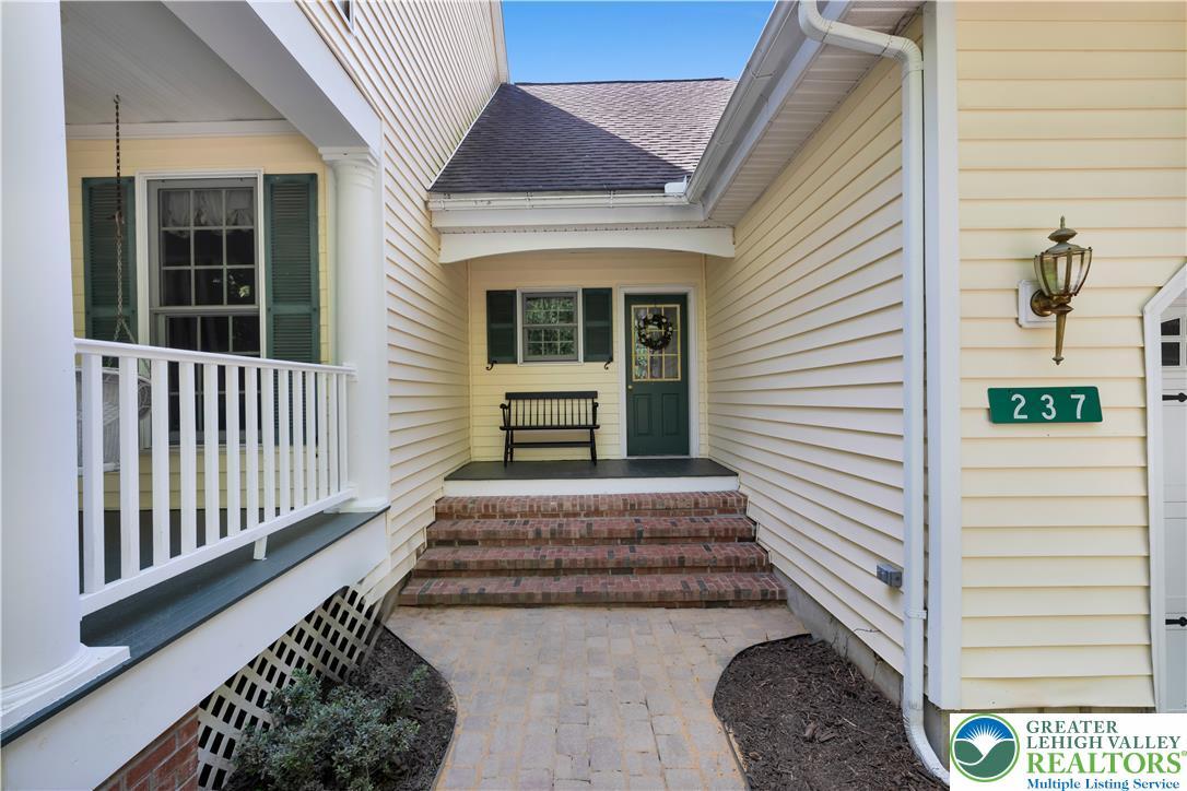 Image 4: A welcoming front entrance featuring brick steps a