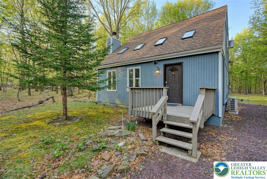 Image 3: The home features an 8x8 front porch.