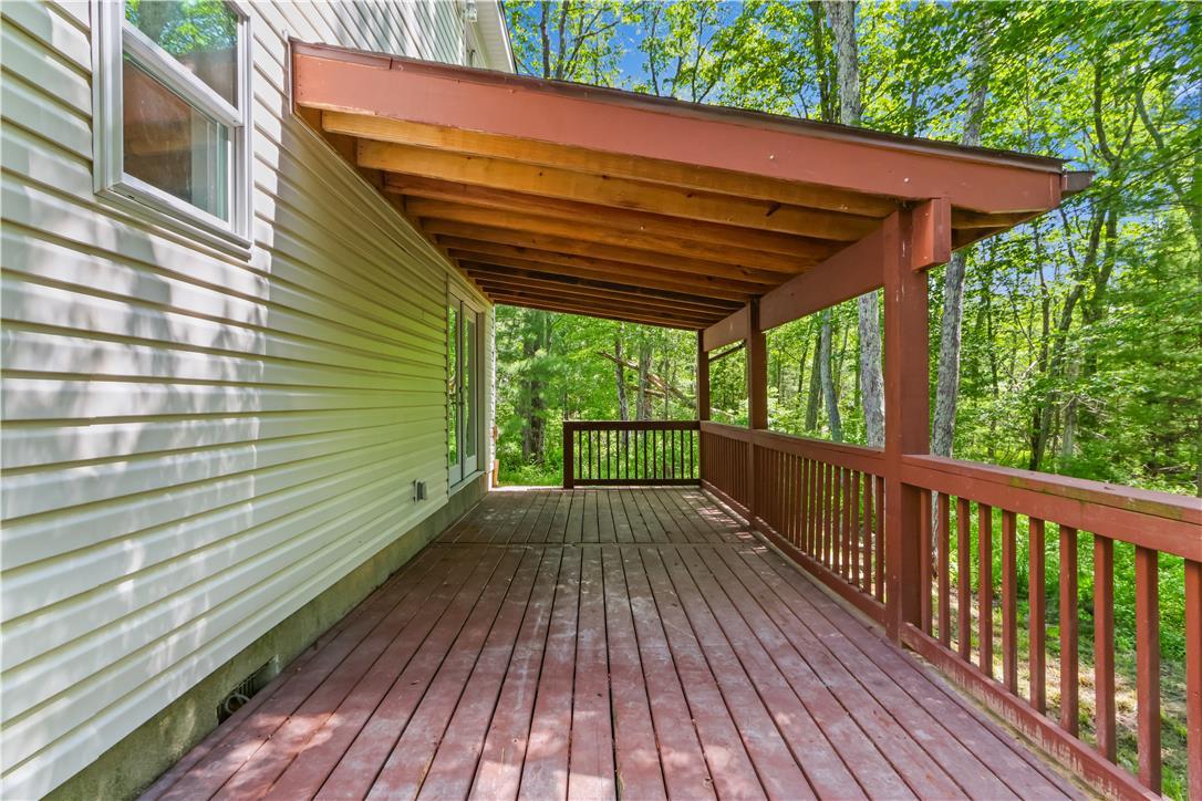 Image 3: Relax on this ample deck, perfect for outdoor livi