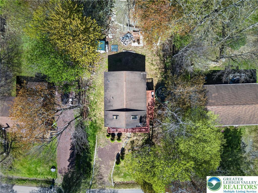 Image 1: An aerial view showcases a residential property ne