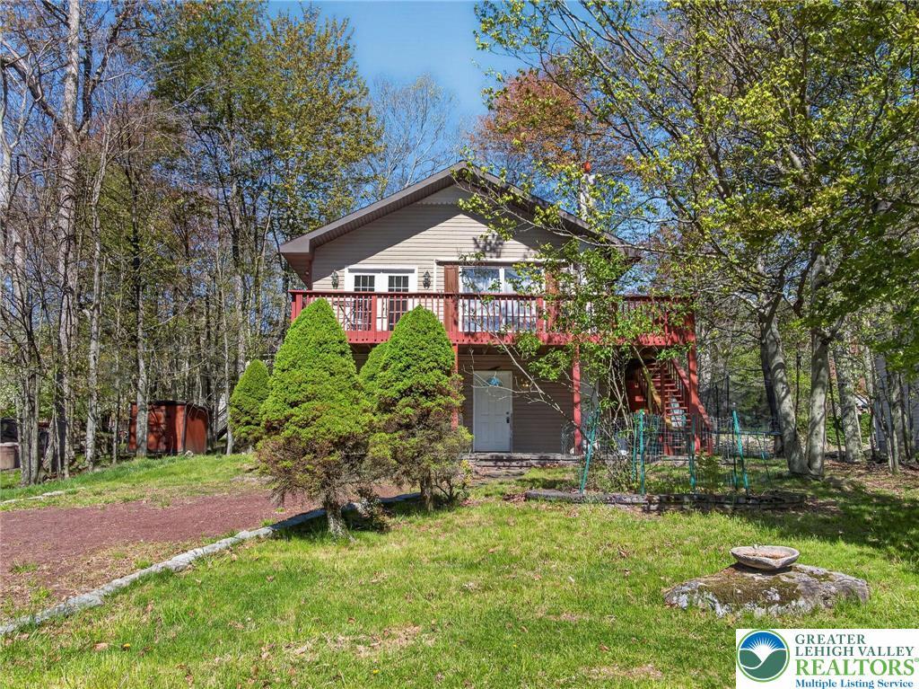 Image 2: This charming home features a lovely front facade,
