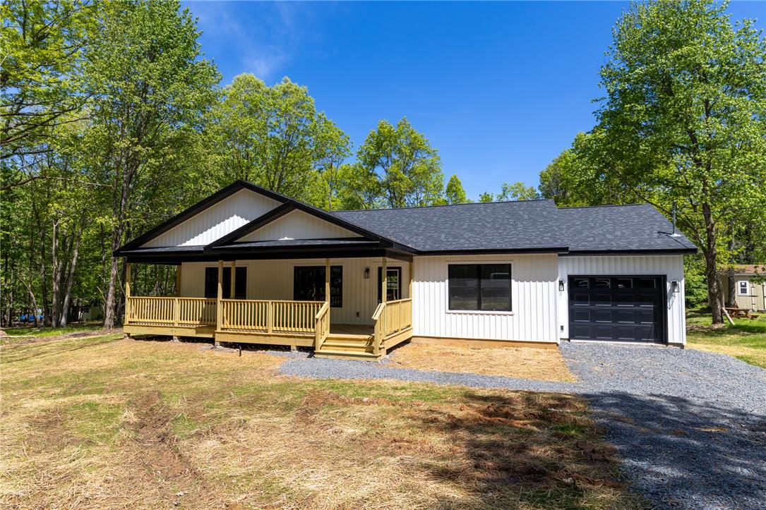 Image 2: A new build with a welcoming porch and attached ga