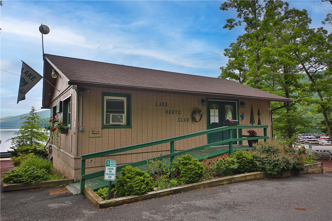 Image 4: A charming lakeside clubhouse awaits, featuring a
