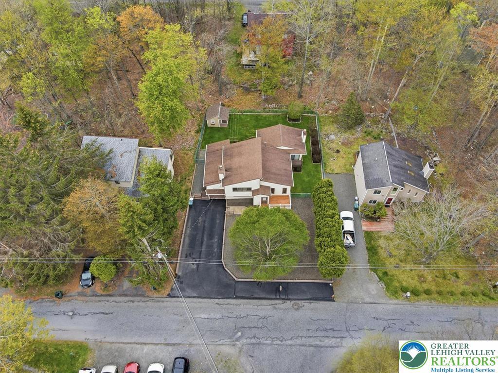 Image 3: An aerial view showcases a charming property nestl