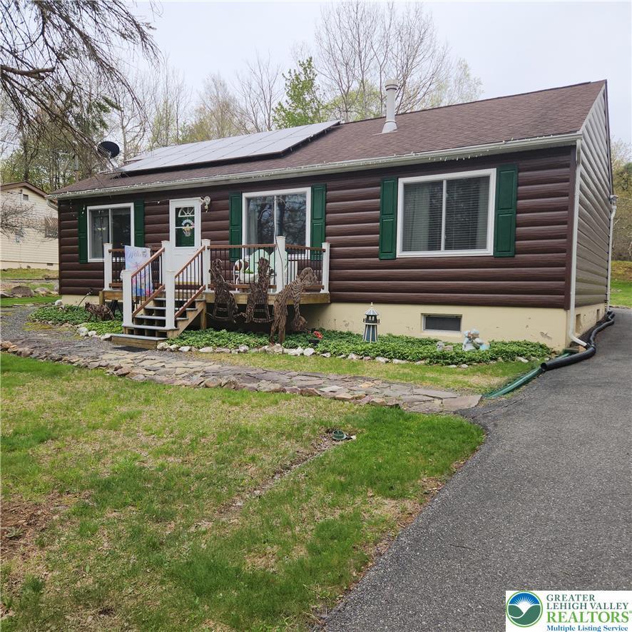 Image 2: This charming home offers a welcoming facade with