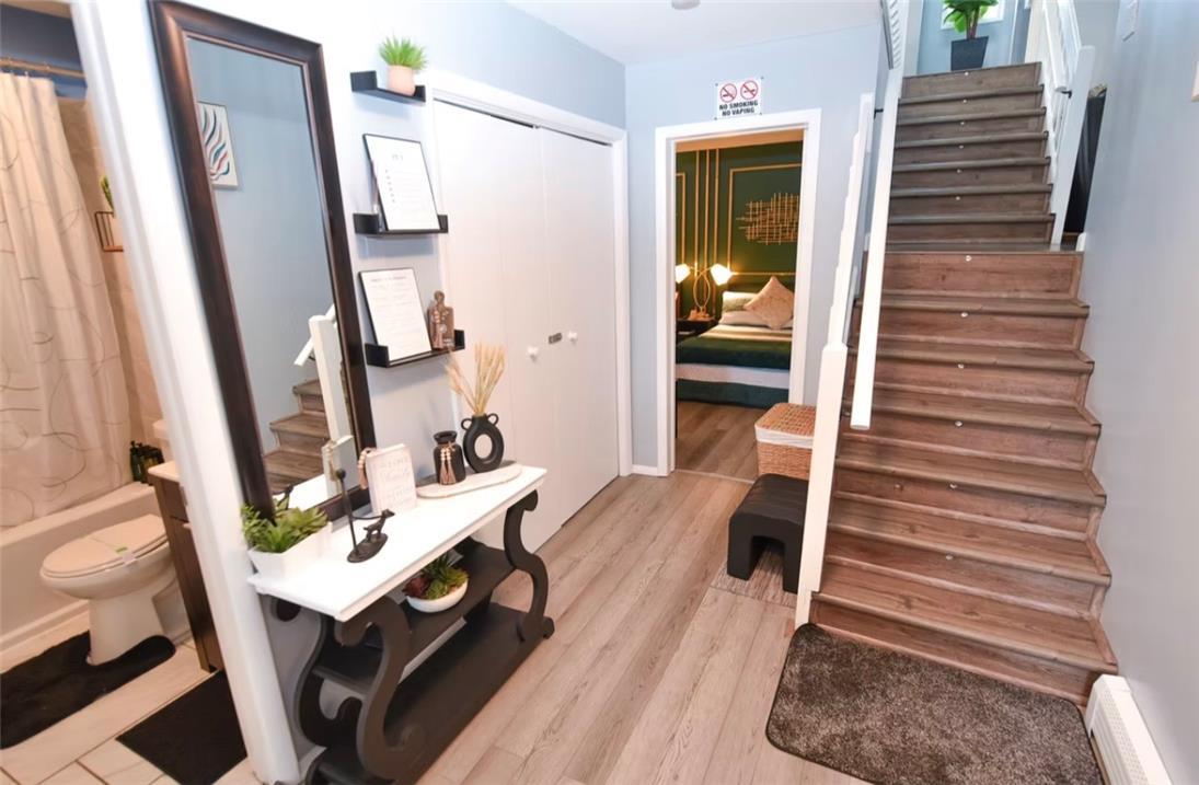 Image 4: A welcoming entryway offers durable flooring and a