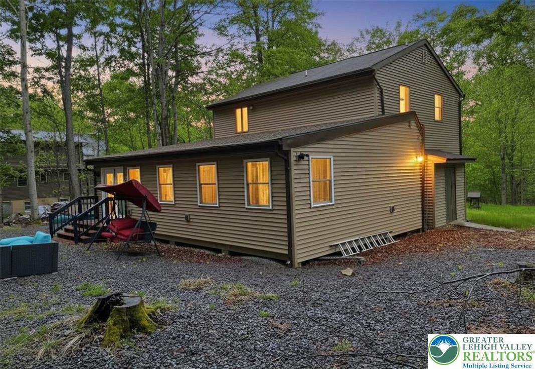 Image 3: A well-maintained facade with horizontal siding of