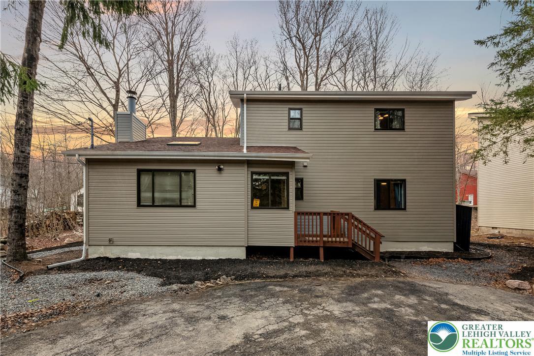 Image 3: A newly constructed modern home nestled amongst a