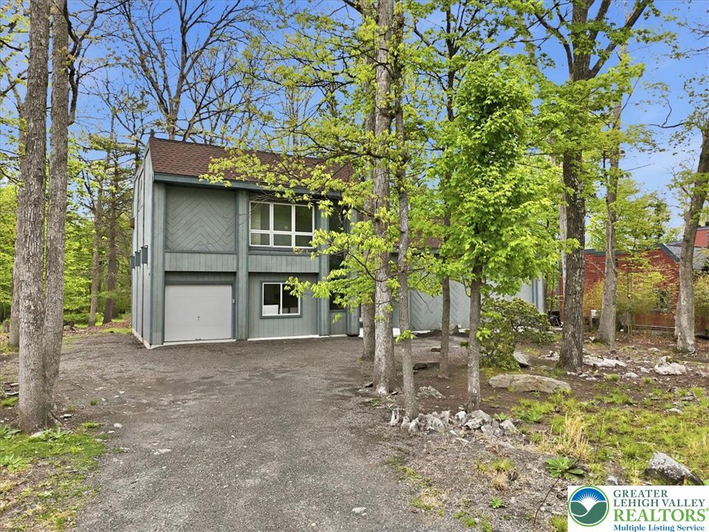 Image 2: A private wooded setting surrounds this charming m