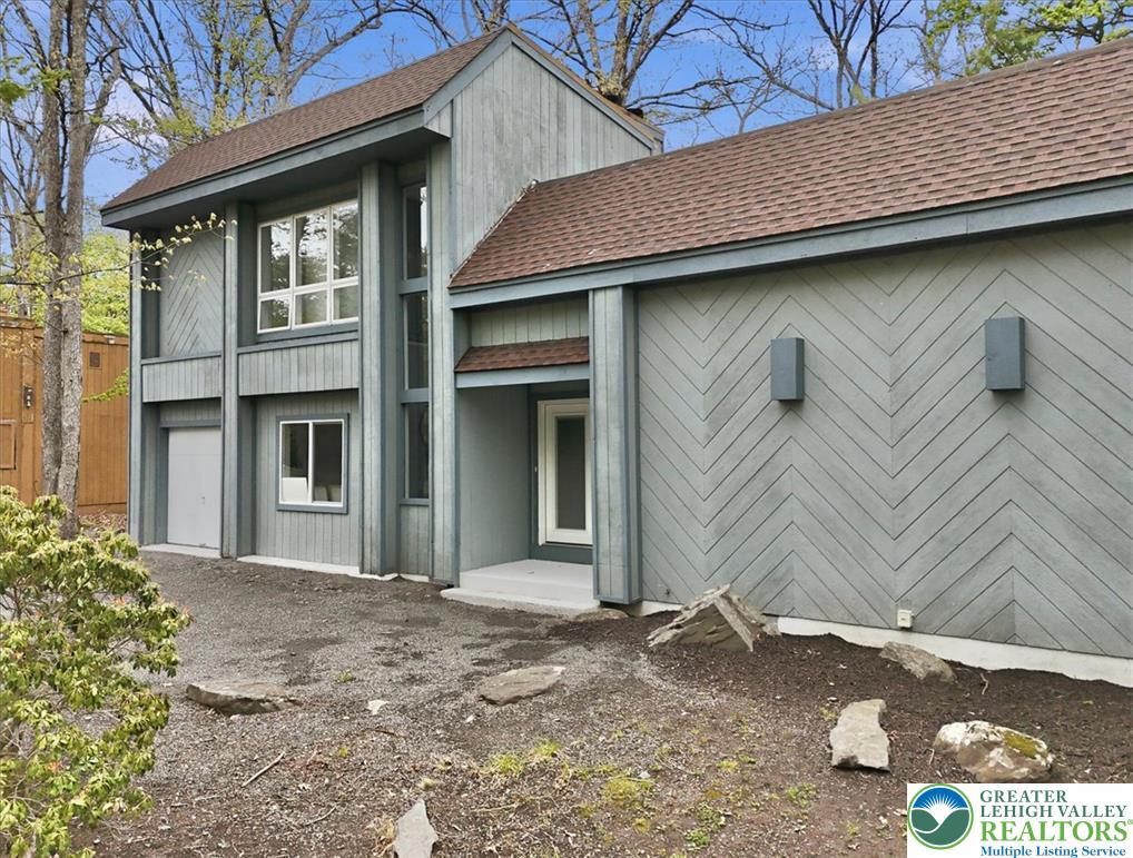 Image 3: Contemporary siding patterns adorn this unique res