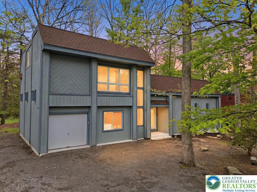 Image 4: This secluded forest dwelling features an attached