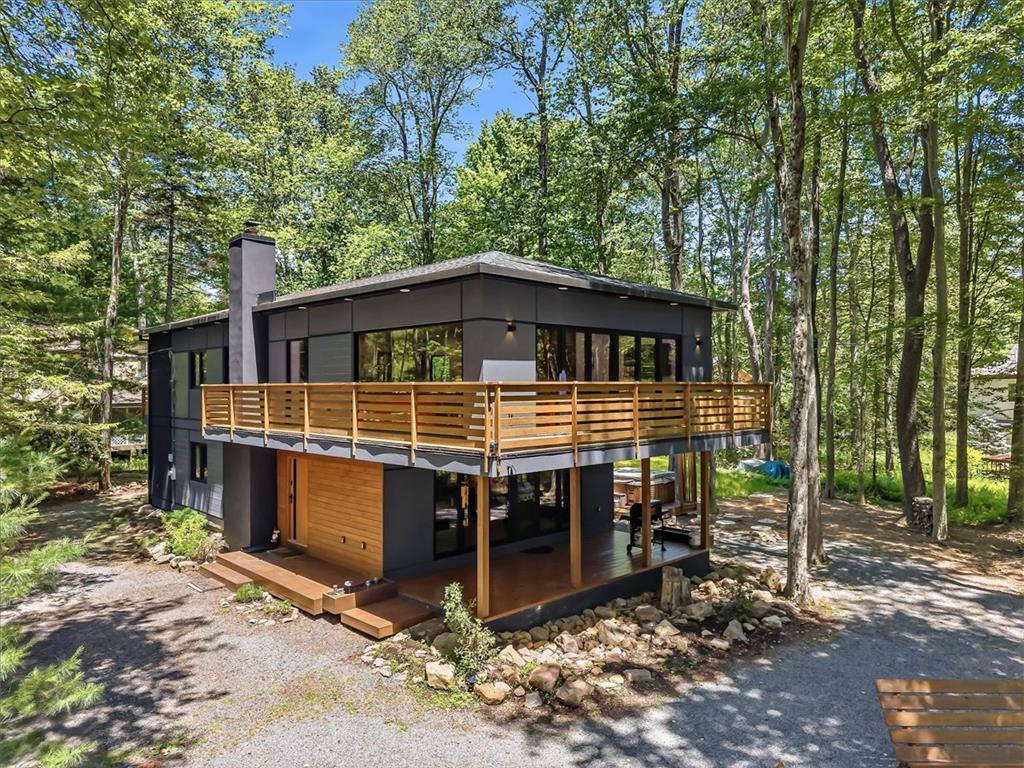 Image 2: Modern architecture in a tranquil, wooded setting