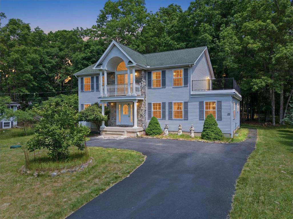 Image 2: A classic home with charming shutters and a privat