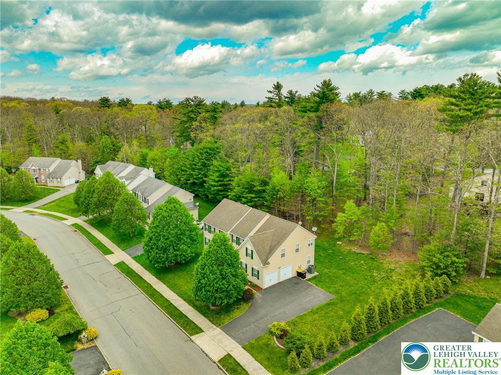 Image 3: This serene neighborhood boasts verdant landscapes