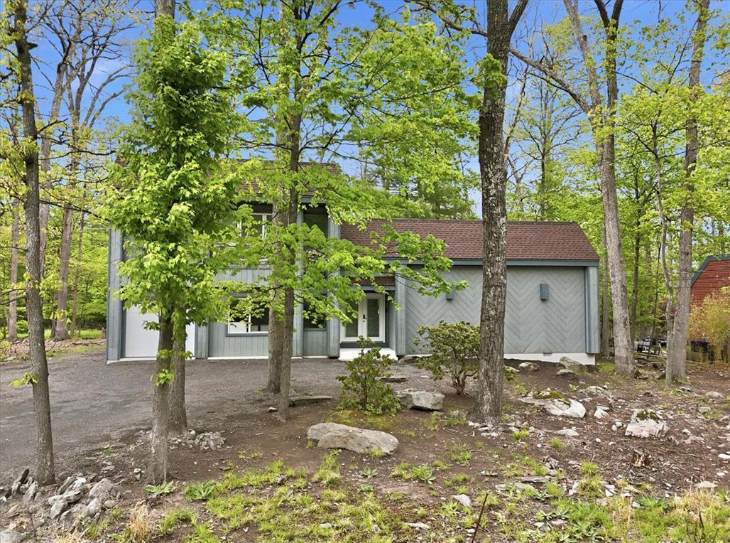 Image 4: A tranquil woodland setting surrounds this charmin