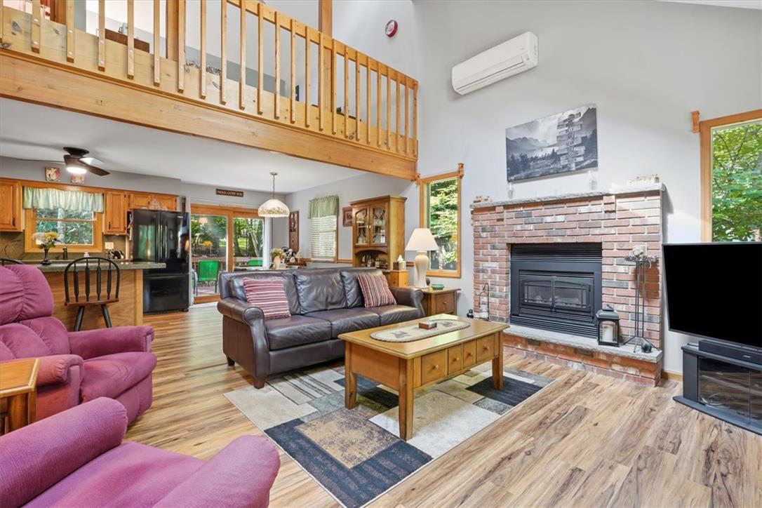 Image 3: An inviting interior with a cozy fireplace and a f