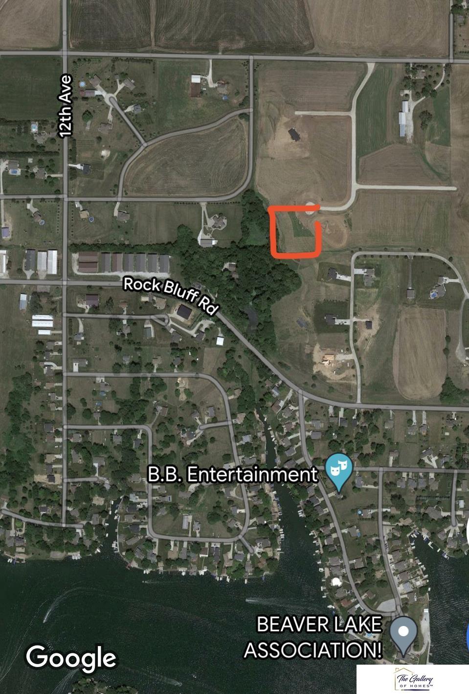 Image 2: Google map image, Feb-2022. Red outline approx. property lines. Views of Beaver lake from property, no lake rights