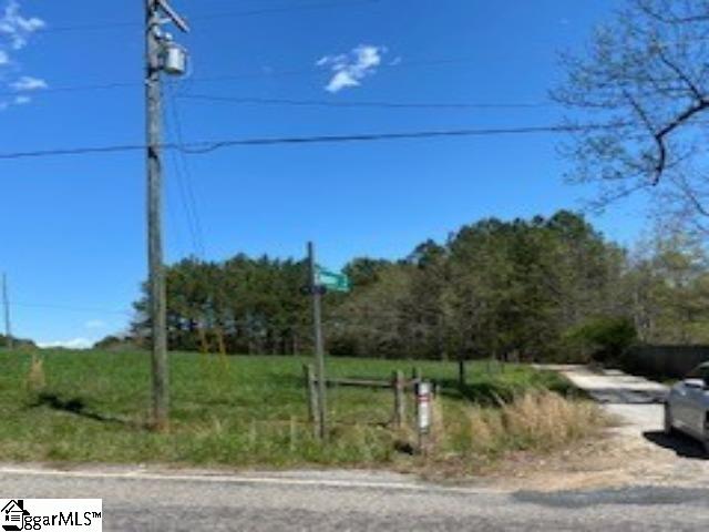 Image 1: Turn on this road to drive to the property