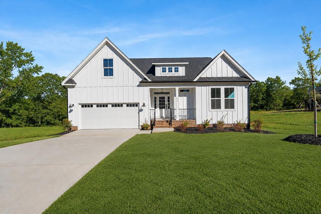 Image 2: Front , This photo is of a different home with different interior finishes with a similar floor plan
