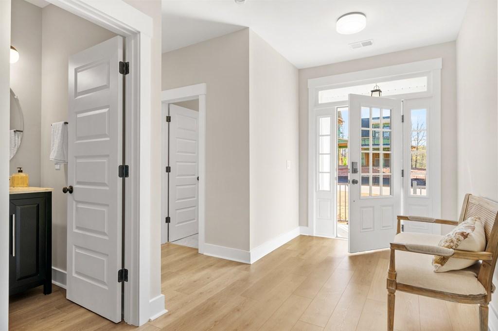 Image 3: Foyer, This photo is of a different home with different interior finishes with a similar floor plan