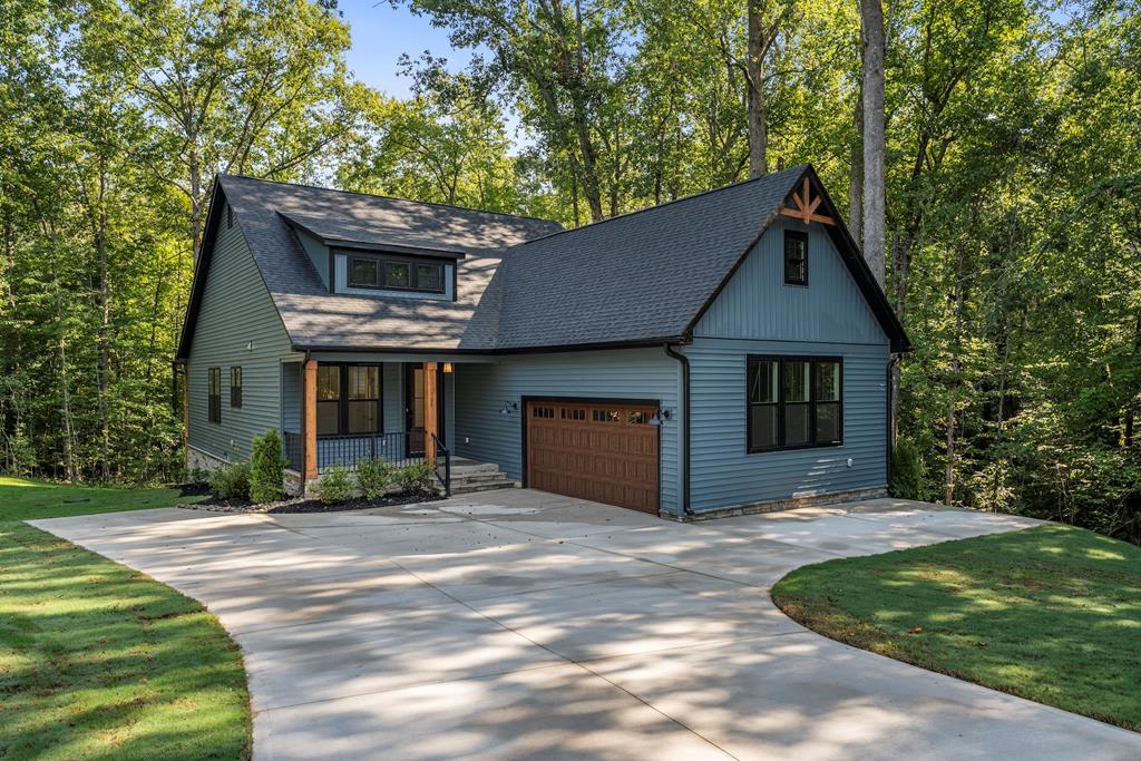Image 2: Home has same courtyard entry with a different ext