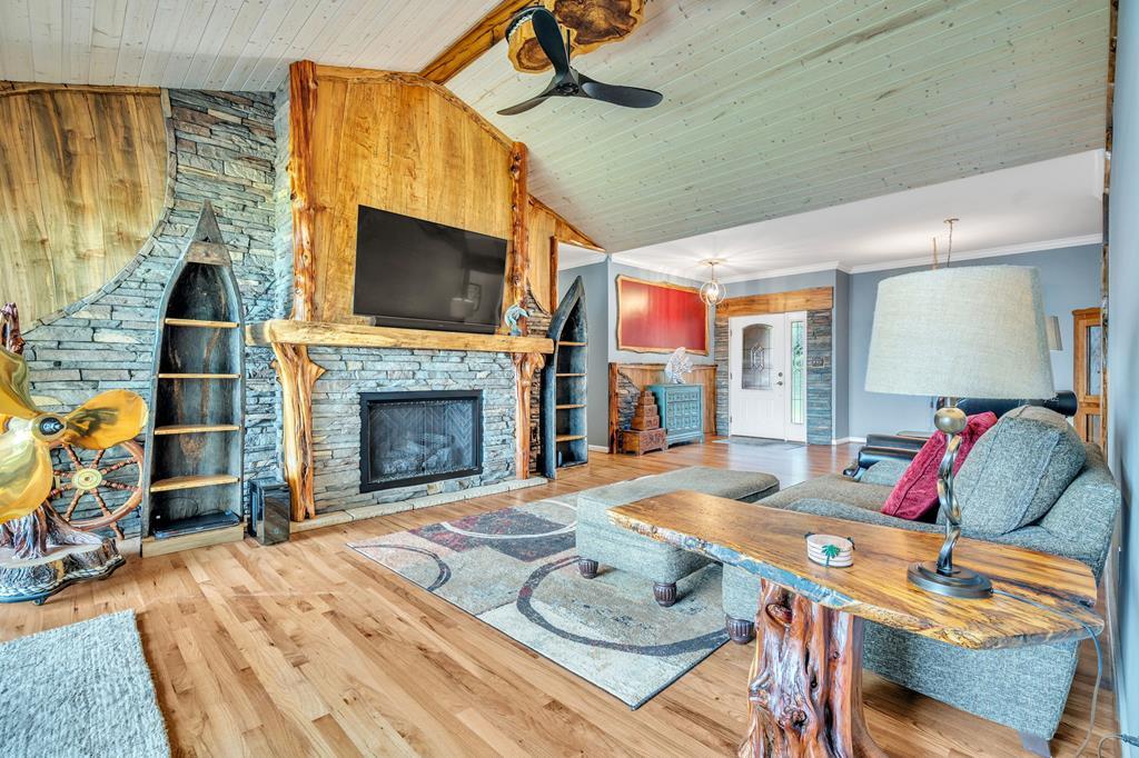 Image 3: Open family room with beautiful, hand carved Ambro
