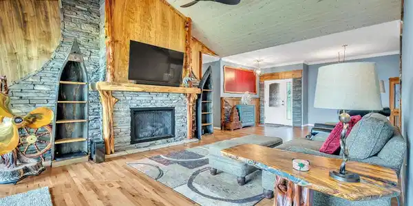 Image 3: Open family room with beautiful, hand carved Ambro