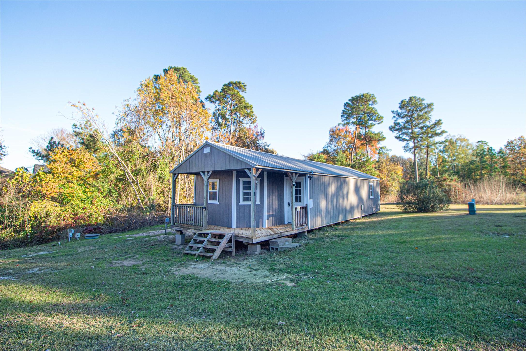 Image 2: Come sit a spell on this covered front porch and e