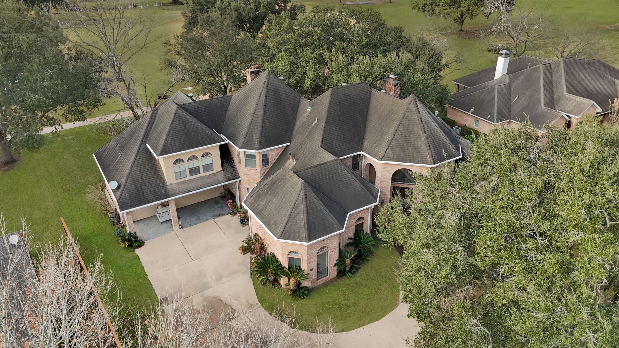 Image 1: This stunning two-story brick home features a time