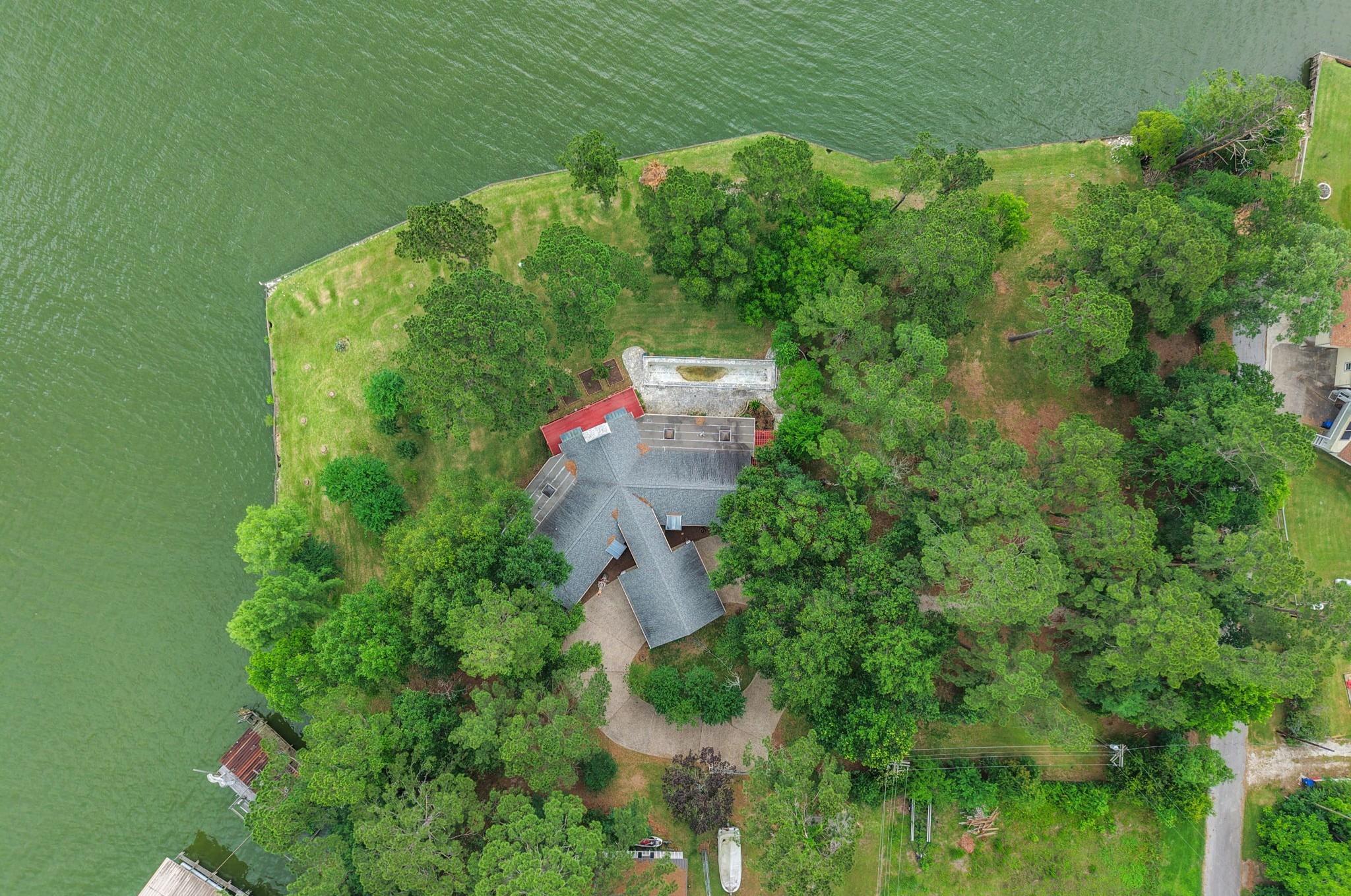Image 2: This unique home is surrounded by the property - p