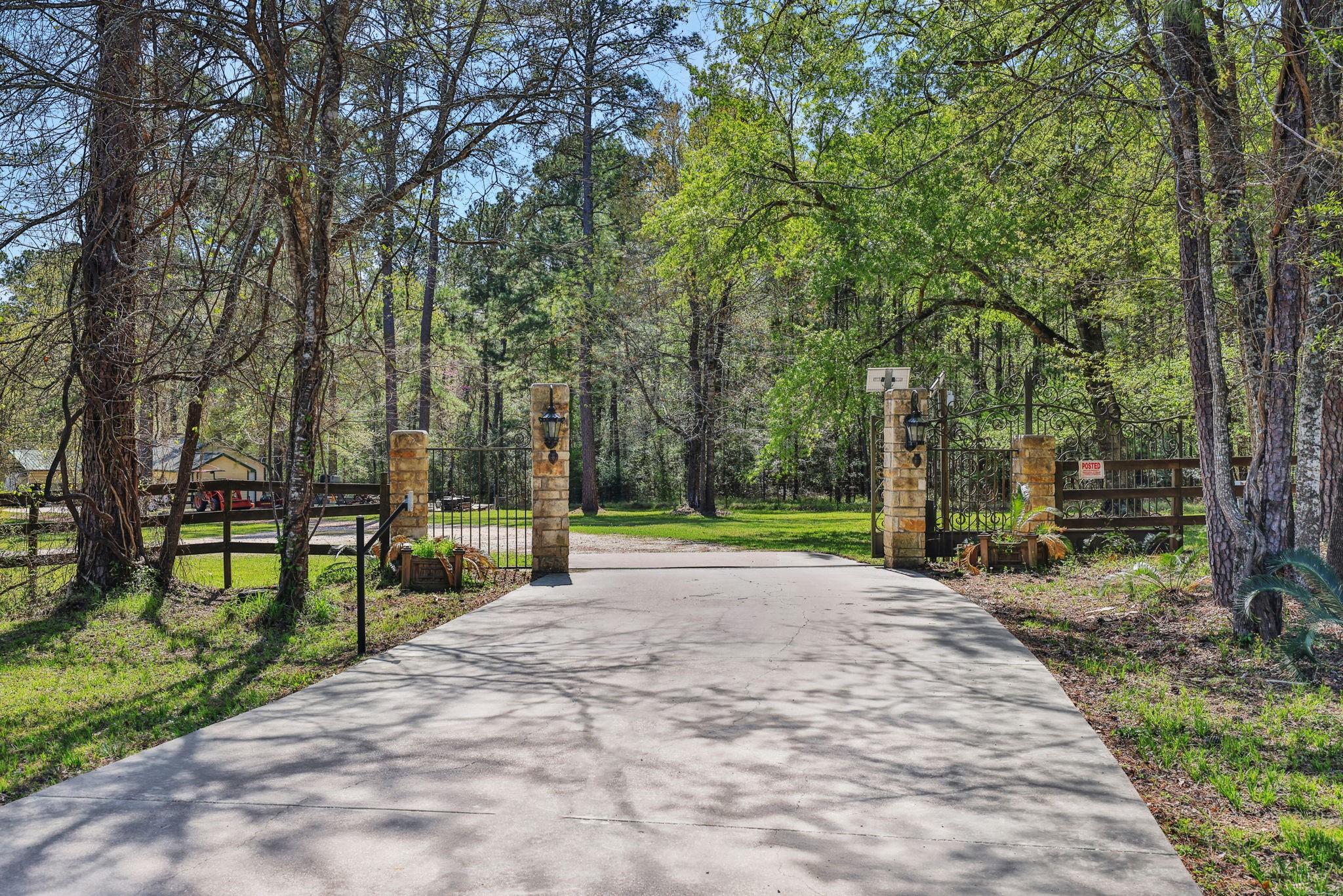 Image 2: The driveway gate off FM 224 is the start of the p