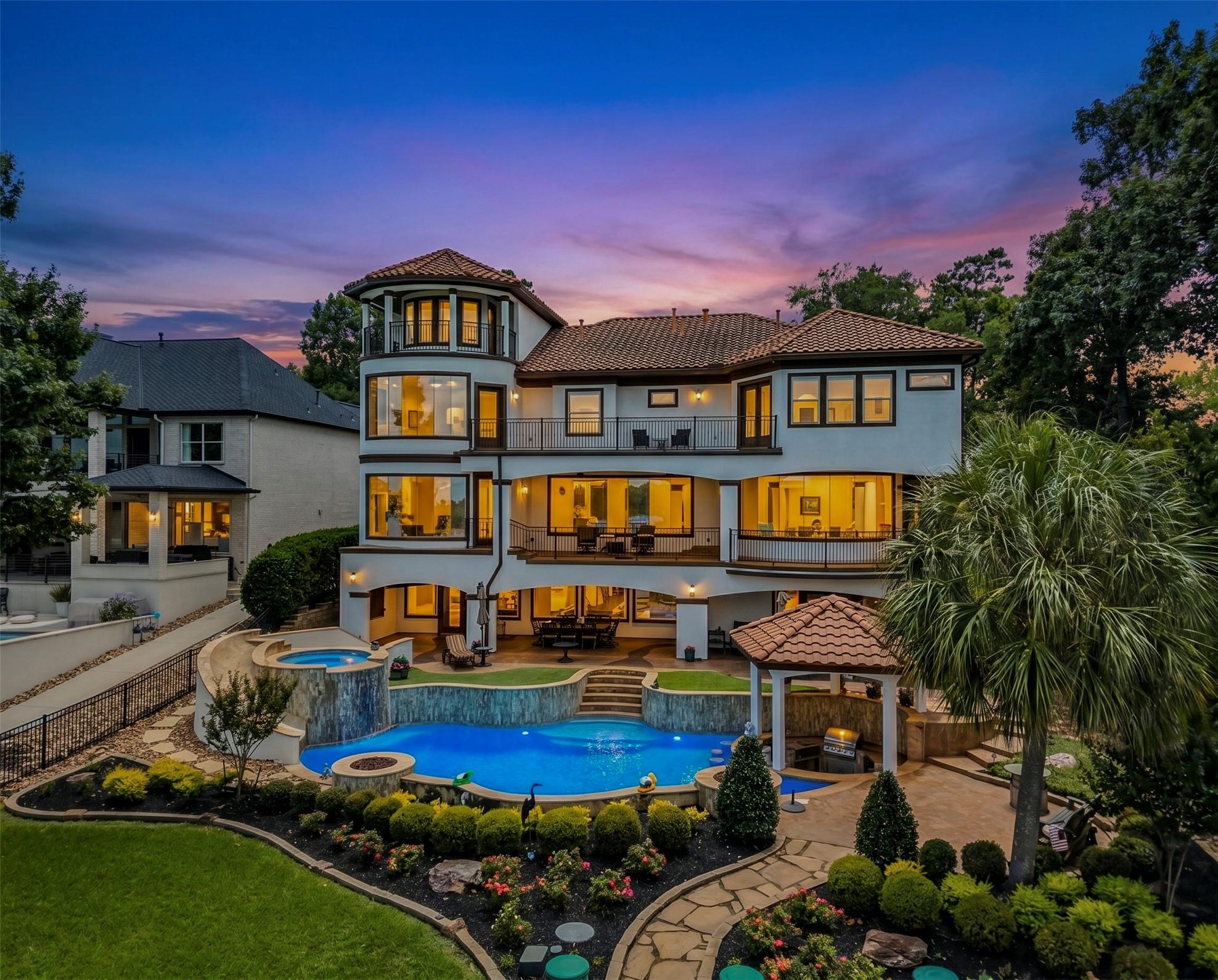 Image 2: Luxurious home with tiled roof, expansive balconie