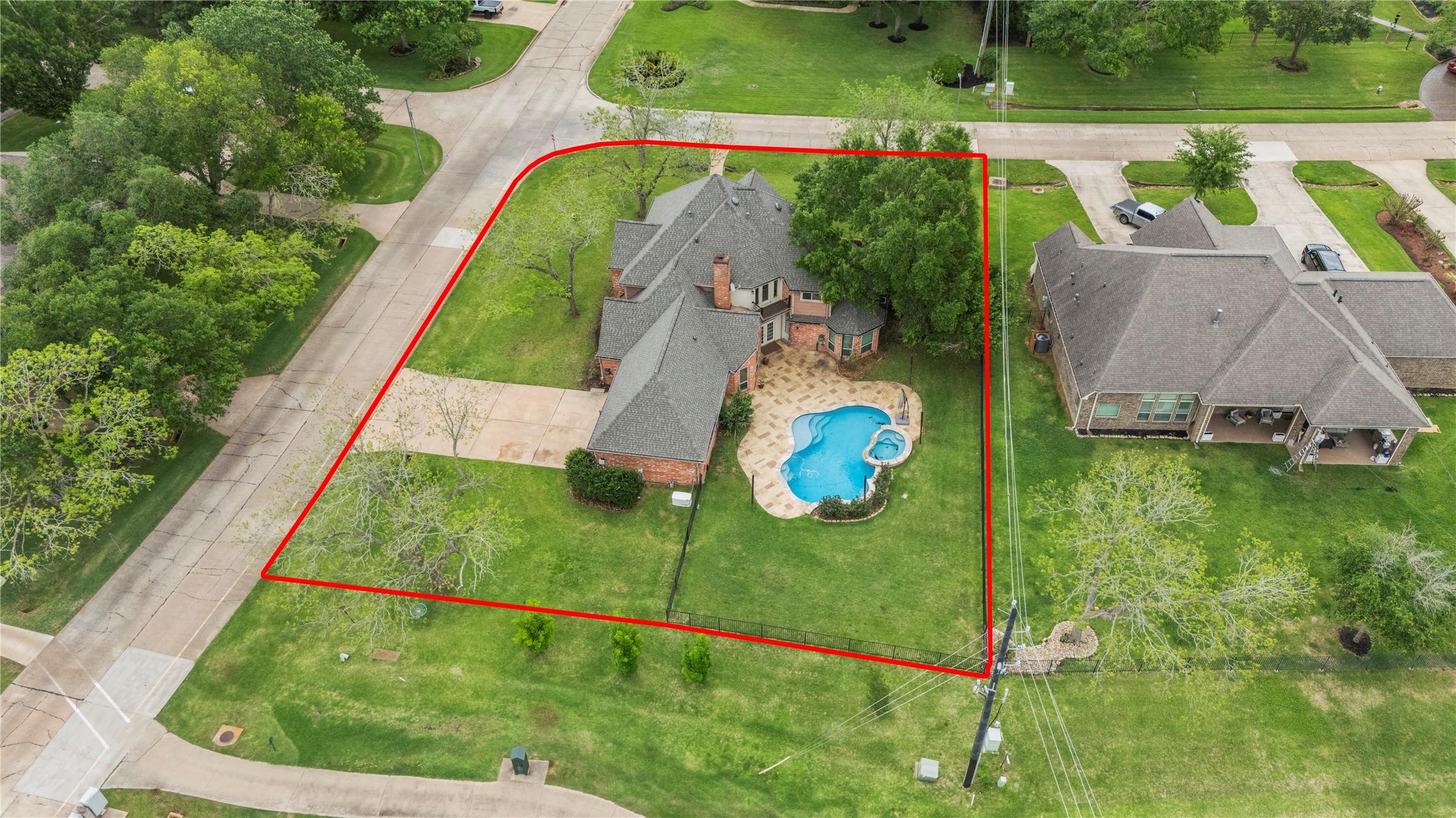 Image 3: Situated on a spacious half-acre corner lot with g