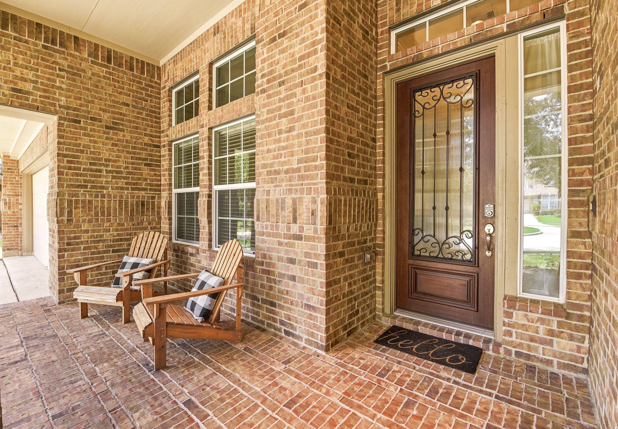 Image 4: Spacious front porch, perfect for relaxing and gre