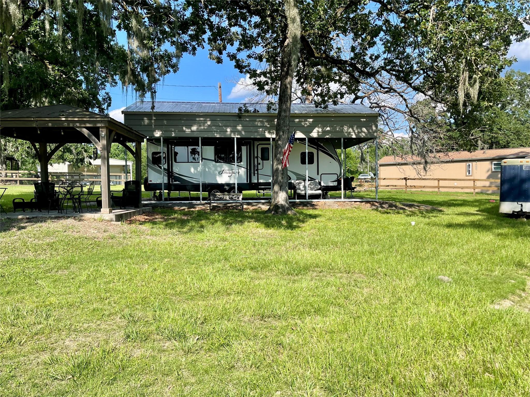 Image 1: This unique property offers two lots with a never-