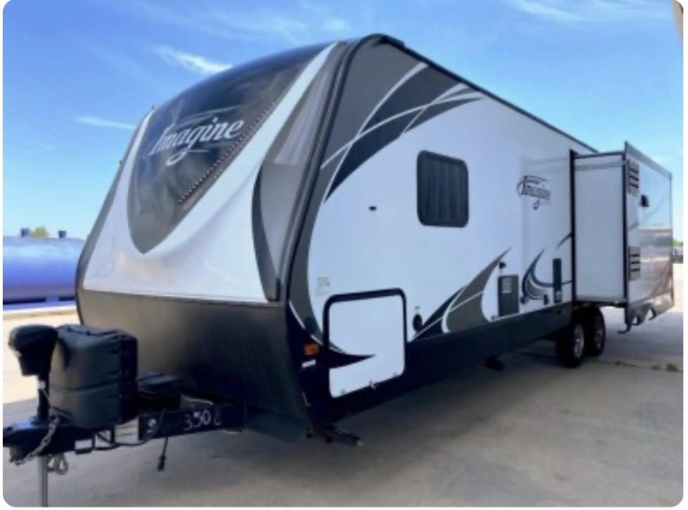 Image 2: Experience ultimate comfort in this stylish RV, fe