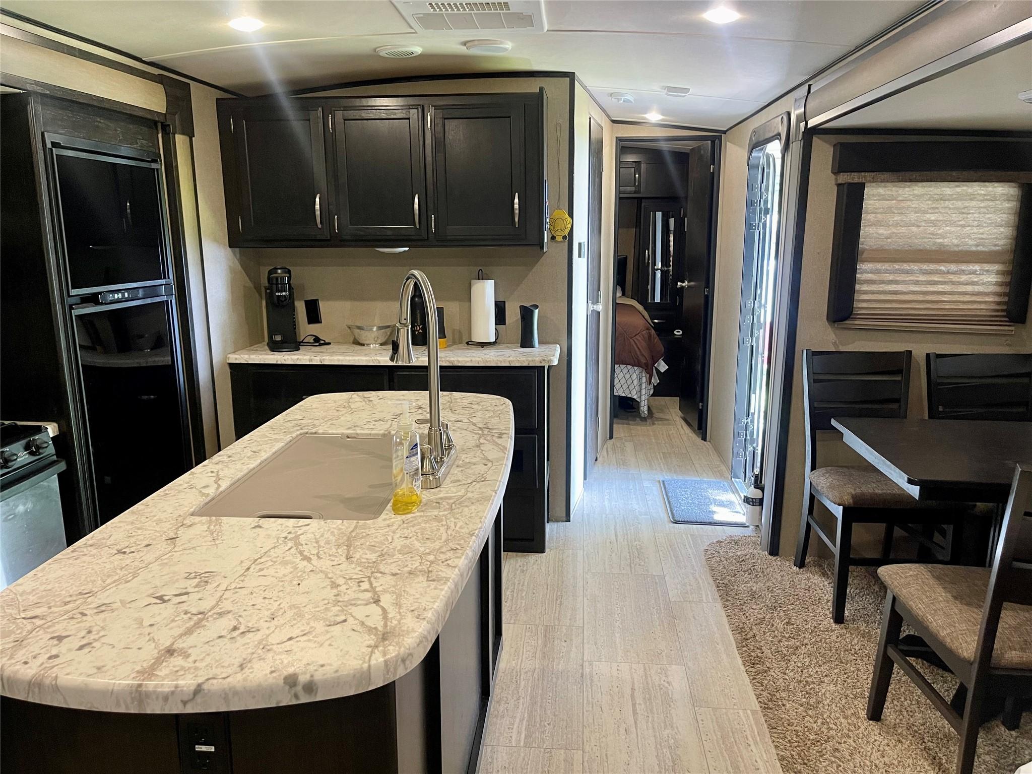Image 3: Experience ultimate comfort in this spacious RV, f